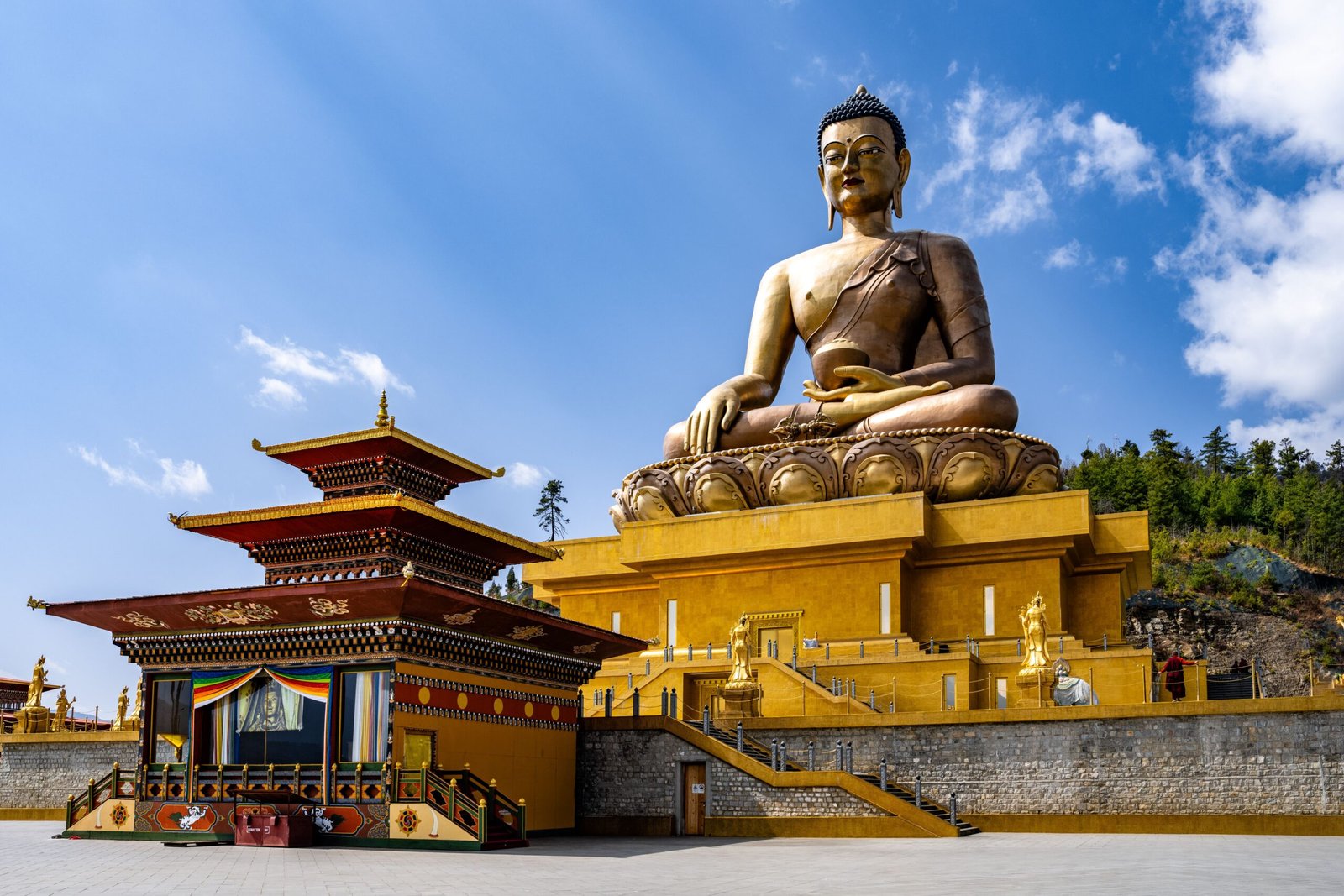 The majestic Buddha Dordenma Statue against the background of a blue sky. Bhutan